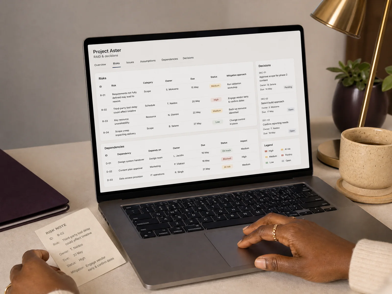 Illustrative project-health workspace with a risk, decision and dependency review on a laptop.